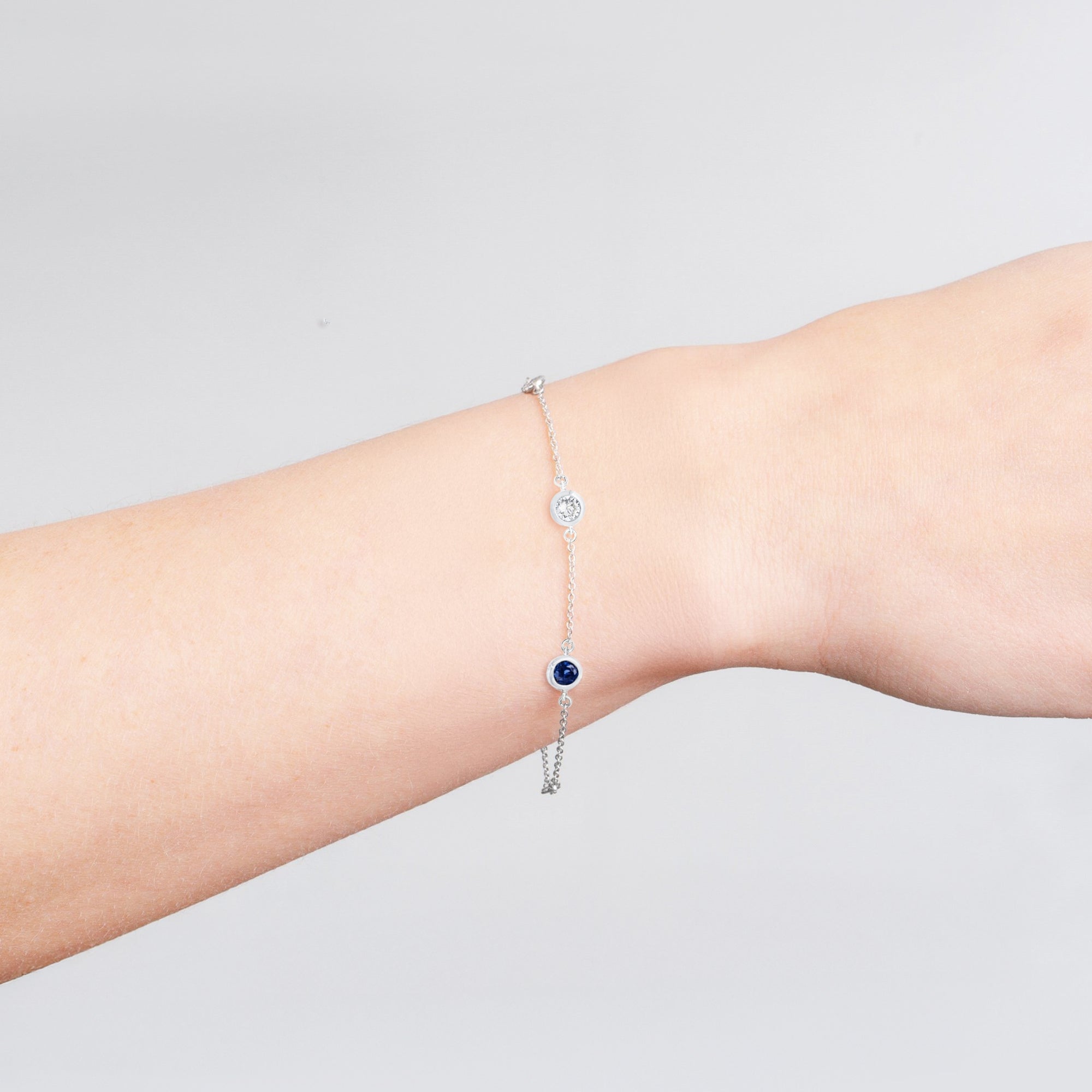 Bezel Set Clear and Sapphire Bracelet Finished in Platinum - CRISLU